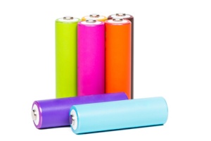 Multicolored AA size batteries isolated on white background.